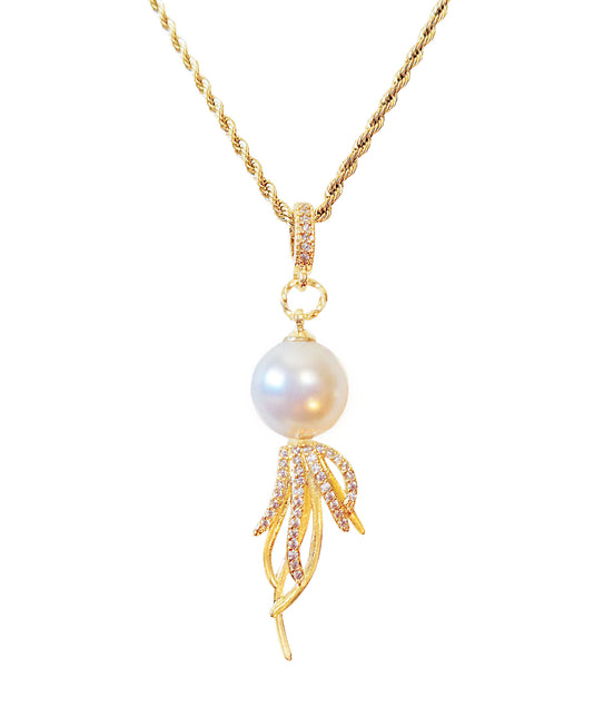 Pearl pendant necklace with gold chain on a white background

