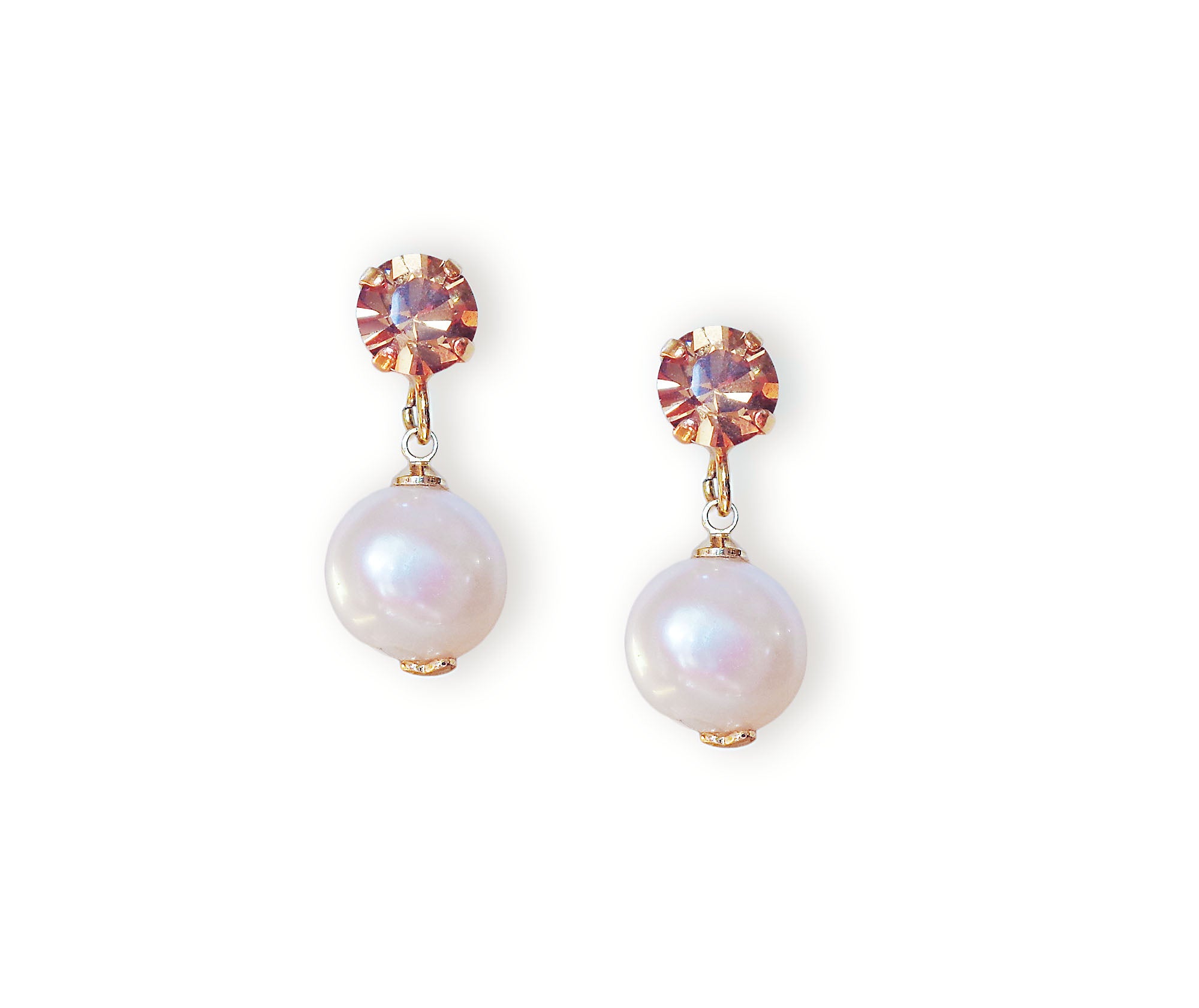 Pair of pearl earrings with light brown accents on a white background.Stud and drop earrings with light brown crystal studs made with Austrian crystals.The pearl drops are freshwater natural pearls colour white