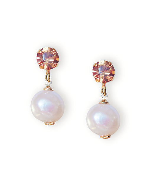 Pair of pearl earrings with light brown accents on a white background.Stud and drop earrings with light brown crystal studs made with Austrian crystals.The pearl drops are freshwater natural pearls colour white