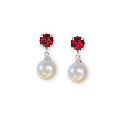 Pair of earrings with red gemstones and pearl drops on a white background
With ruby red crystal round studs about 8mm in size.
