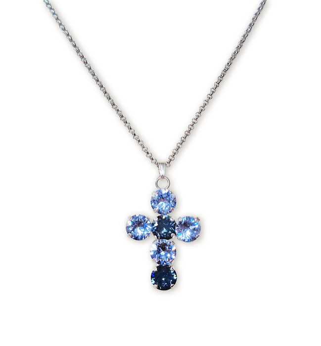 Austrian crystal cross pendant necklace on white backround.The cross is 32 long made with light blue and navy blue crystals.The chain is stainless steel tarnish resistant .The chain length is 43cm and has additional extension chain to adjust.