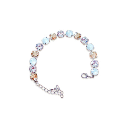 Multicolored tennis  bracelet on a white background.Made with genuine Austrian crystal.A single row of crystals in colours white opal.clear rystal and golden.The bracelet is medium size and fits average wrist.It includes and extension chai
.It is rhodium silver plated nickel free