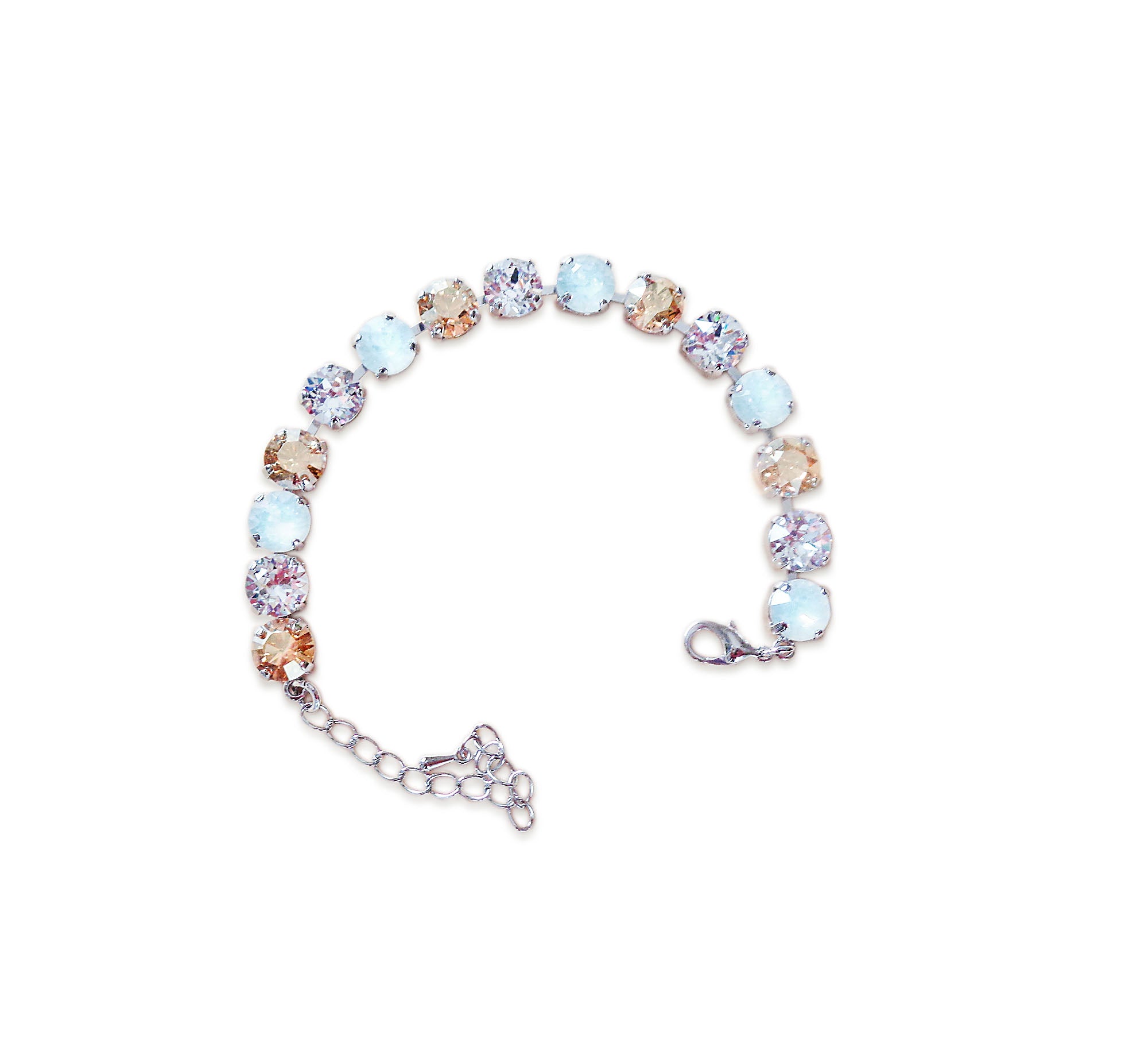 Multicolored tennis  bracelet on a white background.Made with genuine Austrian crystal.A single row of crystals in colours white opal.clear rystal and golden.The bracelet is medium size and fits average wrist.It includes and extension chai
.It is rhodium silver plated nickel free