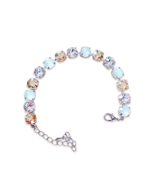 Multicolored tennis  bracelet on a white background.Made with genuine Austrian crystal.A single row of crystals in colours white opal.clear rystal and golden.The bracelet is medium size and fits average wrist.It includes and extension chai
.It is rhodium silver plated nickel free