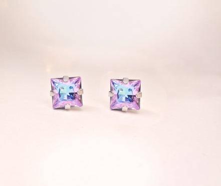 Square stud earrings made with Austrian crystal.These are square stud earrings 8mm size in colour vitrail light which is purple with light blue hues .They are silver plated nickel free.Elegant square earrings