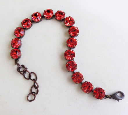 Austrian crystal  tennis bracelet bright red , antique brass