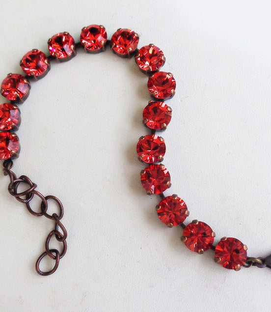 Austrian crystal  tennis bracelet bright red , antique brass