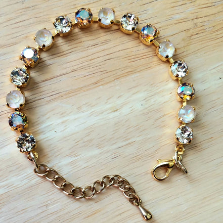 Crystal tennis bracelet beige and topaz,yellow gold