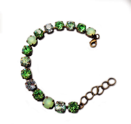 Austrian crystal tennis  bracelet green tones,antique brass