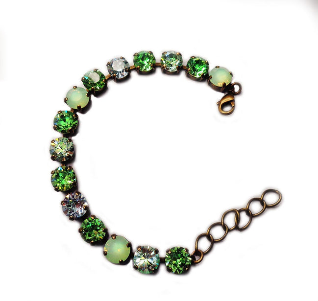Austrian crystal tennis  bracelet green tones,antique brass