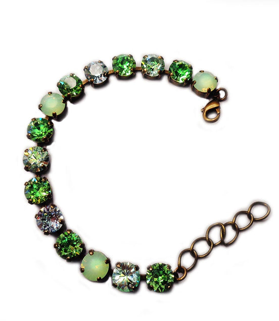 Austrian crystal tennis  bracelet green tones,antique brass