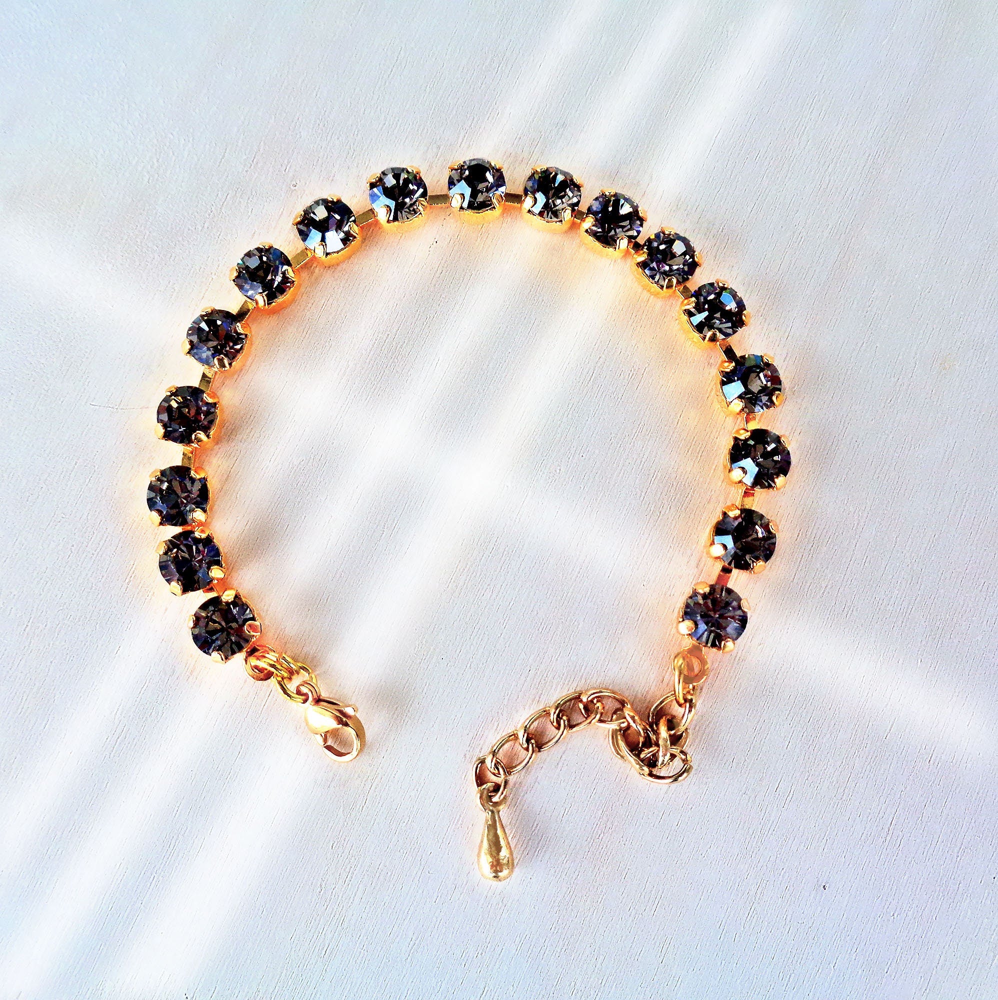 Crystal tennis bracelet black diamond,yellow gold