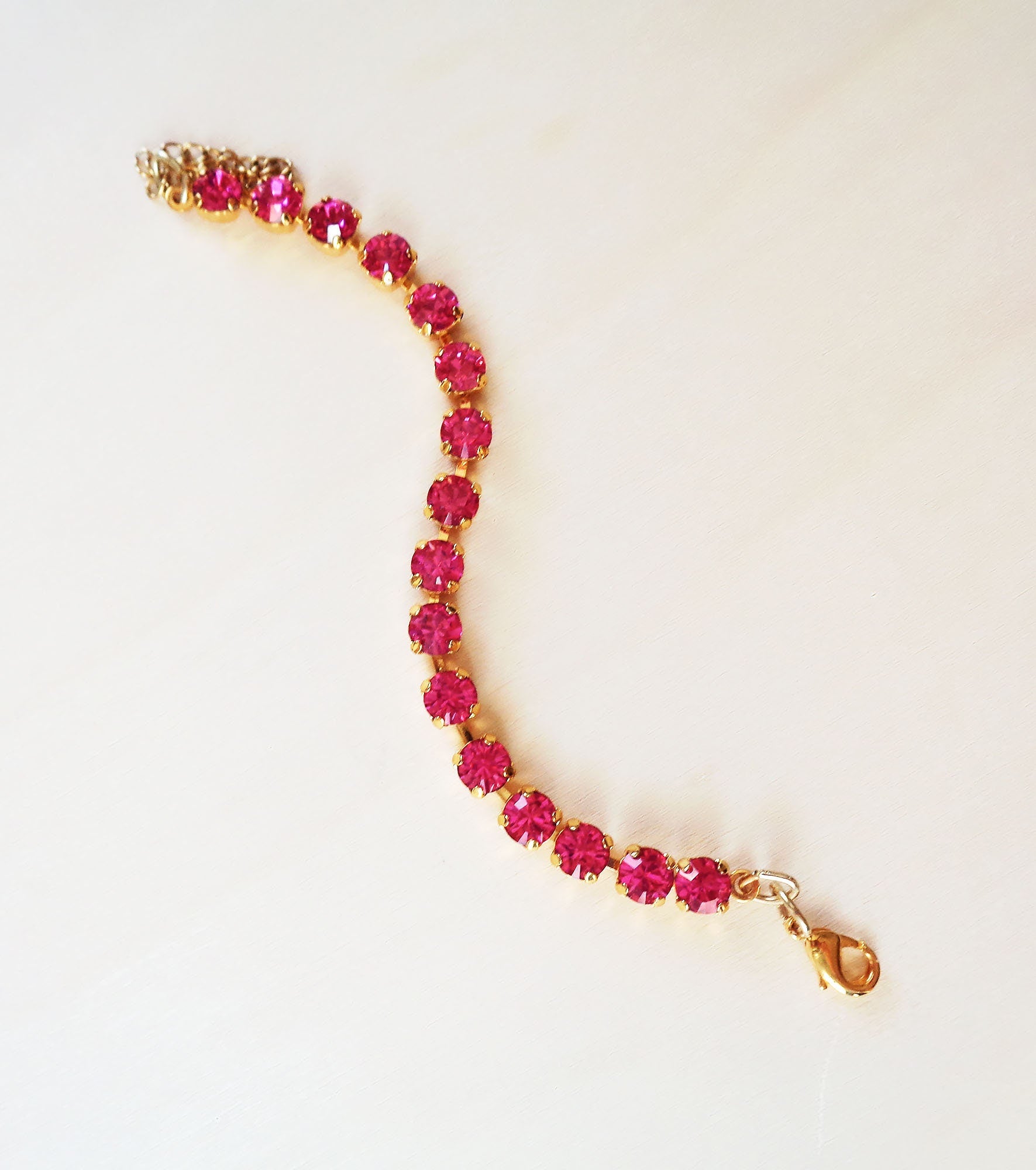 Crystal tennis bracelet fuchsia ,yellow gold