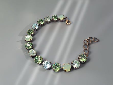 Austrian crystal tennis  bracelet green tones,antique brass