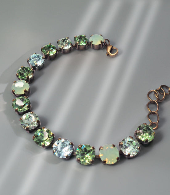Austrian crystal tennis  bracelet green tones,antique brass