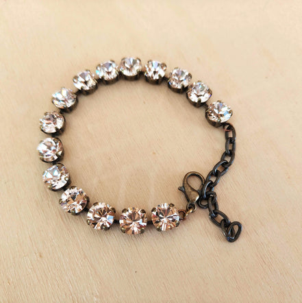 Austrian crystal tennis style bracelet  silk ,antique brass