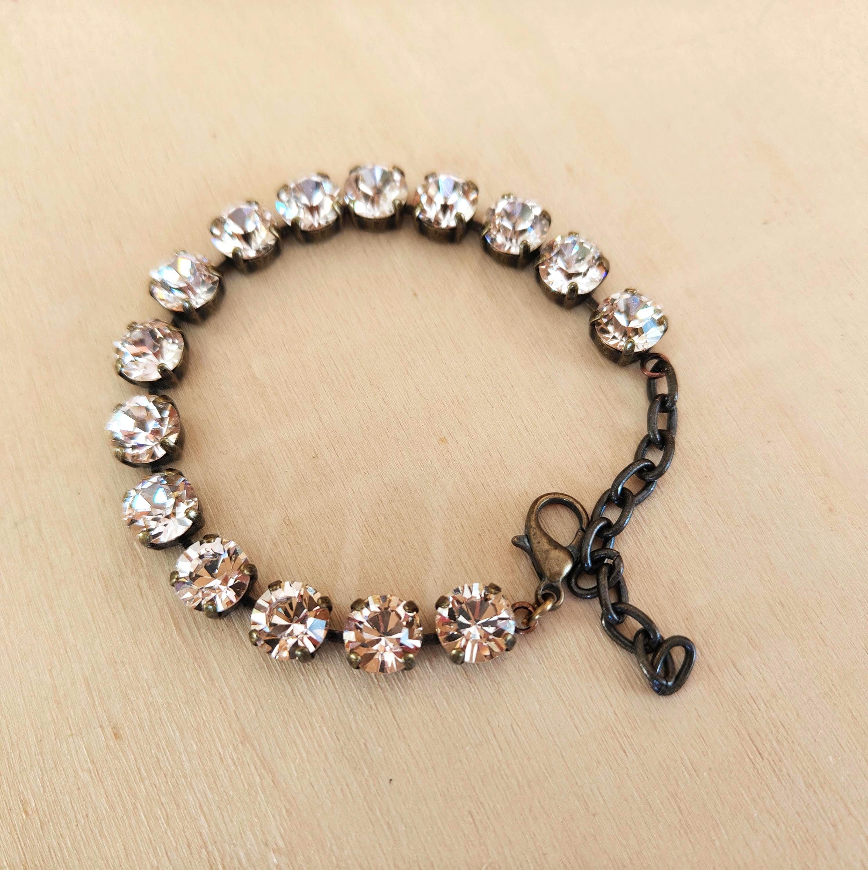 Austrian crystal tennis style bracelet  silk ,antique brass