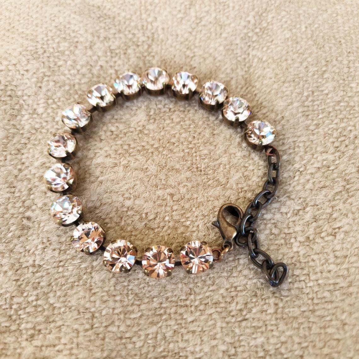 Austrian crystal tennis style bracelet  silk ,antique brass