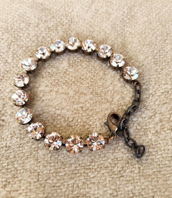 Austrian crystal tennis style bracelet  silk ,antique brass