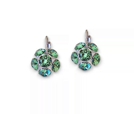 Pair of green gemstone earrings on a white background
Rhodium silver plated Austrian crystal earrings in colour green erinite which is a warm green colour medium tone.Very elegant and light weight .The drop consists of siz crystals in half ball shape