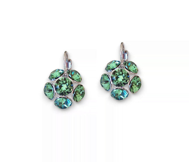 Pair of green gemstone earrings on a white background
Rhodium silver plated Austrian crystal earrings in colour green erinite which is a warm green colour medium tone.Very elegant and light weight .The drop consists of siz crystals in half ball shape