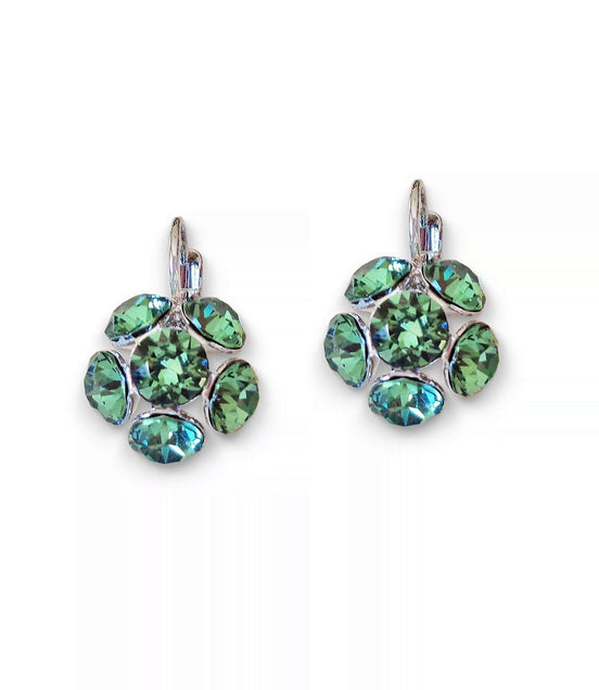 Pair of green gemstone earrings on a white background
Rhodium silver plated Austrian crystal earrings in colour green erinite which is a warm green colour medium tone.Very elegant and light weight .The drop consists of siz crystals in half ball shape