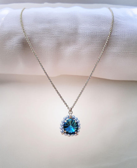 Crystal and pearl round pendant necklace blue indicolite