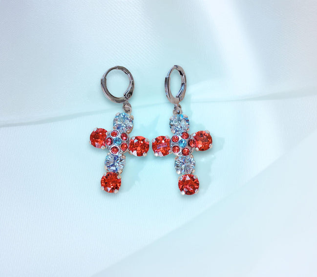 Cross-shaped earrings with red and clight blue gemstones on a light blue 
background
These are made with real Austrian crystals .Rhodium silver plated nickel free 