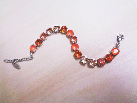 Austrian crystal tennis bracelet  orange and peach ,rhodium silver